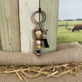 "Handmade Highland cow metal keyring with coastal beaded accents, Australian-made animal lover gift"