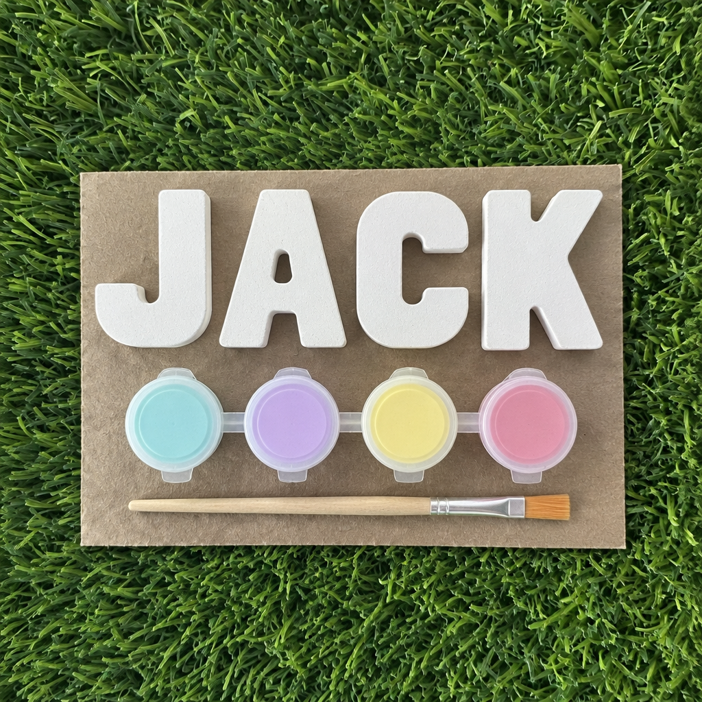 Plaster name kit spelling JACK with four pastel paint pots and a brush
